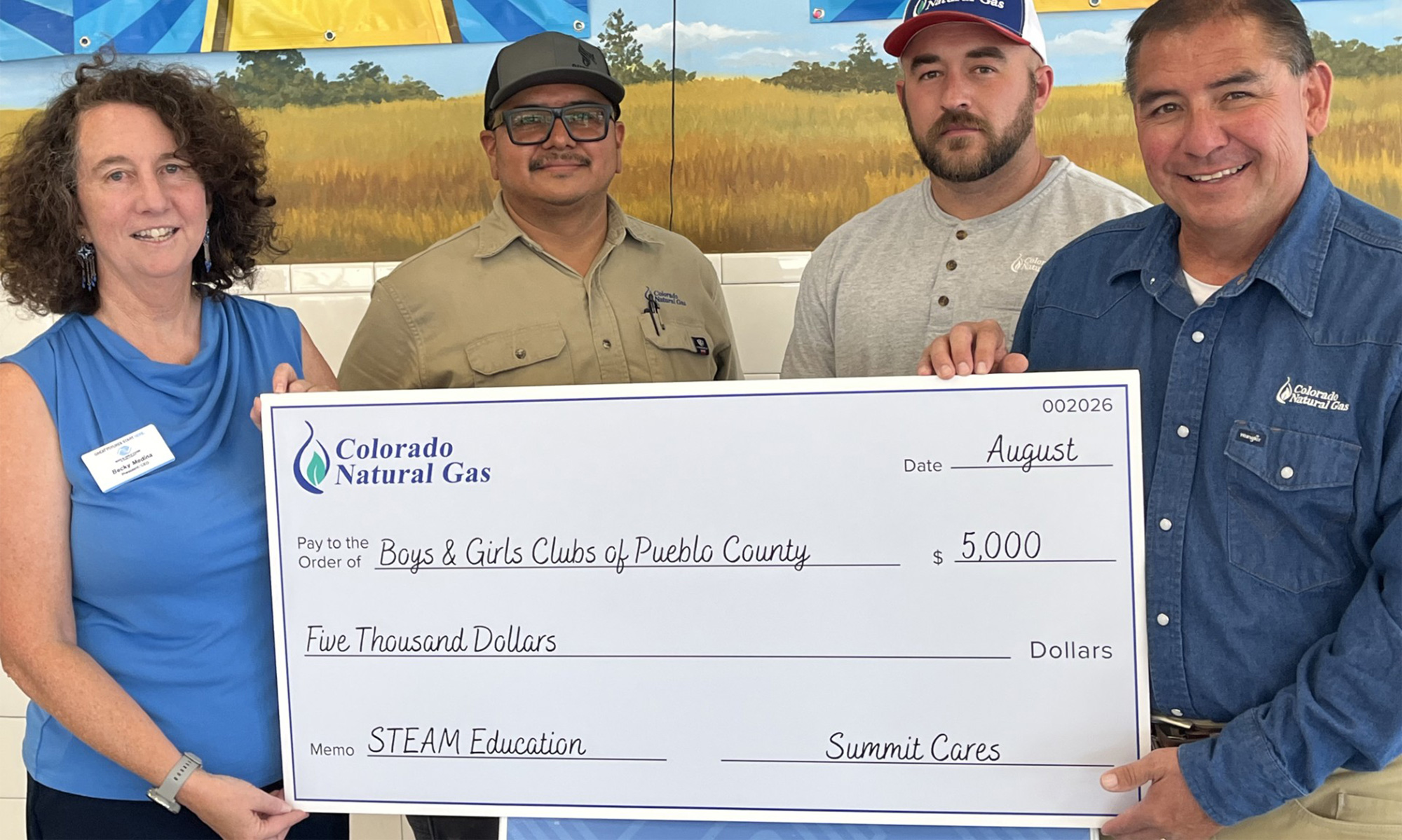 Colorado Natural Gas presents a $5,000 Summit Cares grant to the Boys & Girls Clubs of Pueblo County